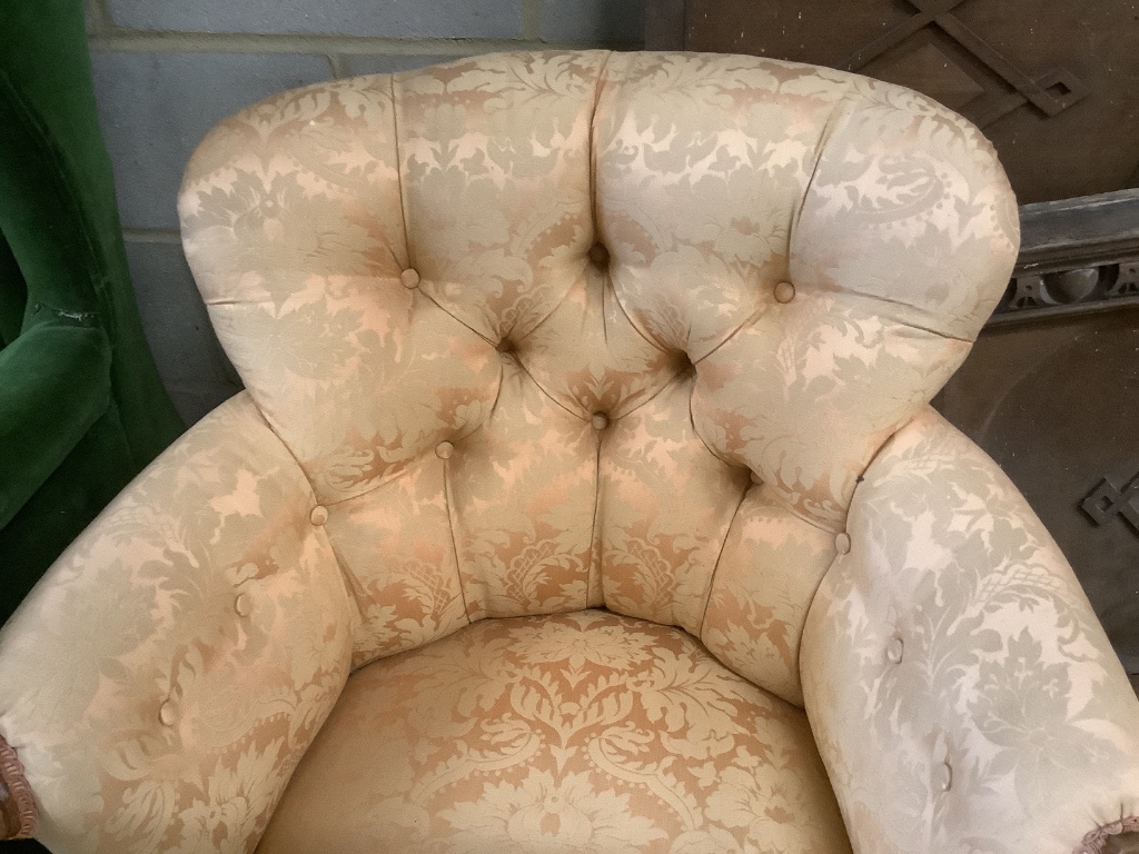 A Victorian walnut button back armchair, width 77cm